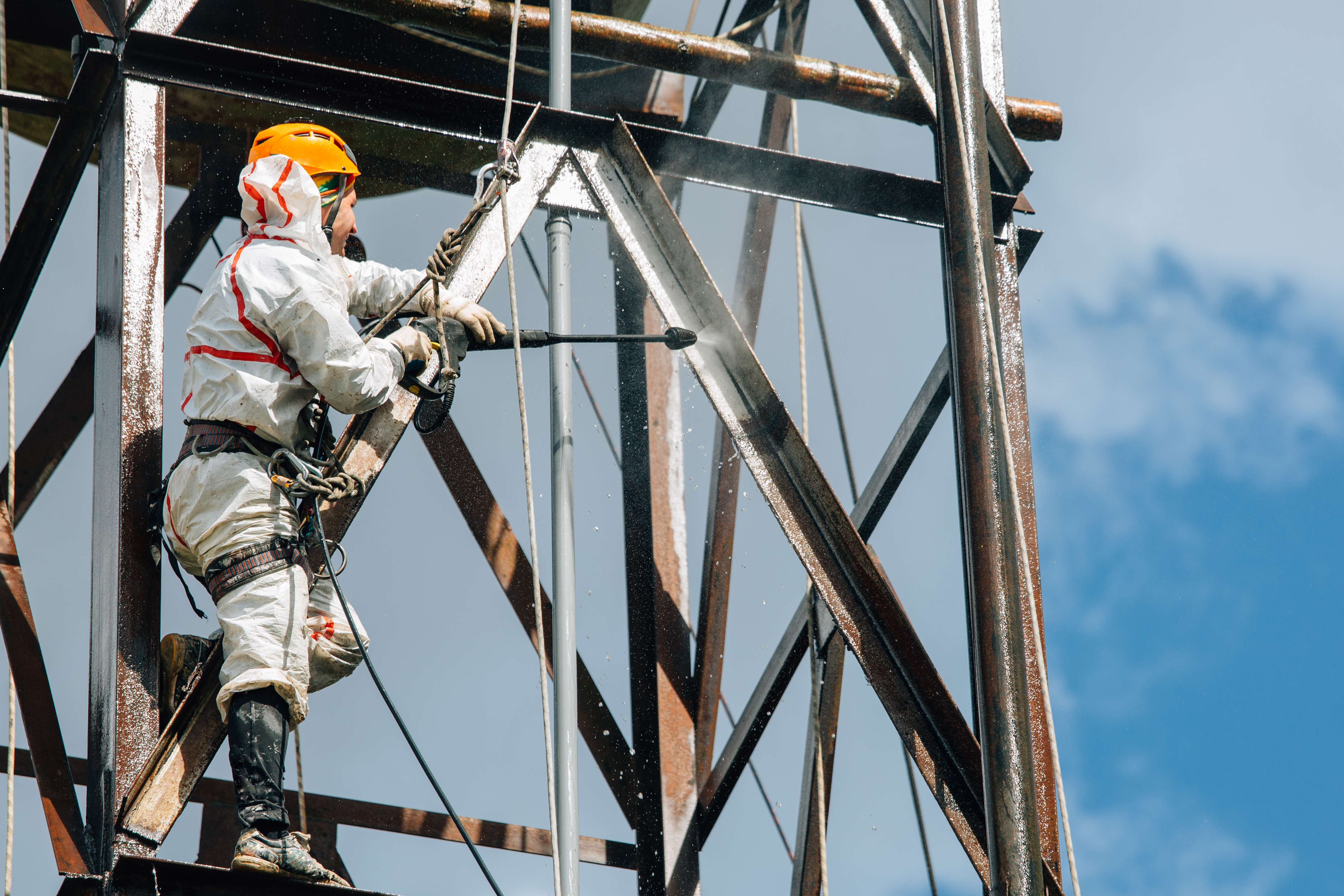 Industrial,Climber,Washing,Big,Barrel,With,Water,Pressure.,Risky,Job.